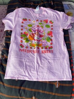 Delta Pink Graphic Tee with Red & Green Strawberry Design